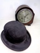 An oak cased Bentima eight day mantel clock and a bowler hat