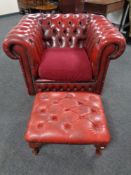 A red button leather Chesterfield club armchair and a similar footstool