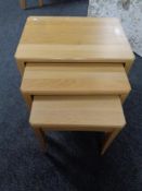 A nest of three Ercol Artisan tables