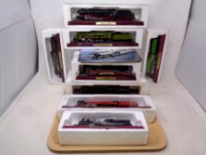 A tray of twelve Atlas Editions models of locomotives with accompanying magazines