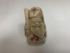 A Japanese bone carving - Bearded Old Man with Stick.