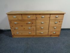 A stripped pine thirteen drawer block chest