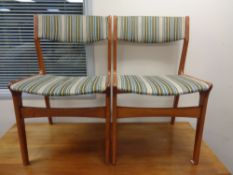A pair of mid 20th century teak dining chairs