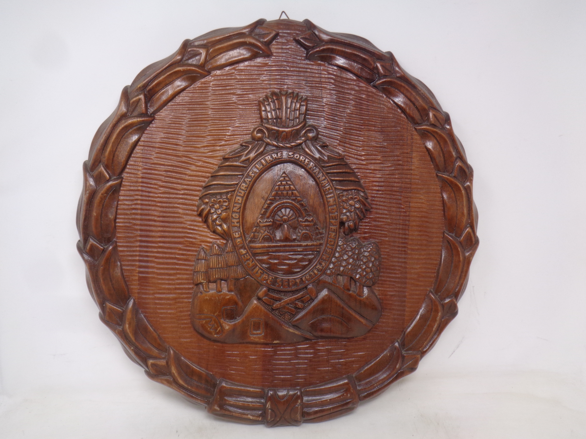 A carved oak plaque to commemorate Honduras independence