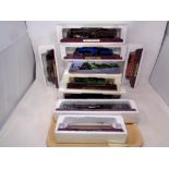 A tray of twelve Atlas Editions models of locomotives with accompanying magazines