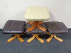 Four assorted leather upholstered footstools