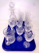 A tray of cut glass lead crystal decanter and tankard together with a set of six wine glasses and a