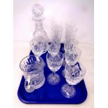 A tray of cut glass lead crystal decanter and tankard together with a set of six wine glasses and a