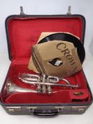 A Woods & Company chrome cornet in case and three vinyl 78 records on HMV,