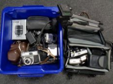 A box and a camera bag of assorted vintage and digital cameras, tripod,