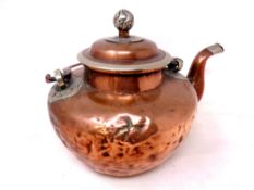 An antique Chinese copper kettle