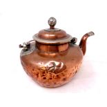 An antique Chinese copper kettle