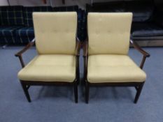 A pair of late 20th century stained beech armchairs with gold cushions