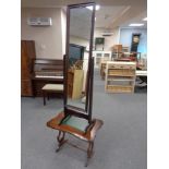 A cheval mirror and an occasional table