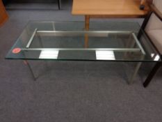 A 20th century Scandinavian glass topped coffee table on metal base