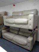 A three seater settee and two seater settee upholstered in beige leather