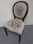 A beech framed occasional chair in tapestry fabric