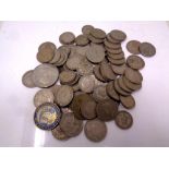 A bag containing a quantity of British coins to include shillings, assorted crowns,