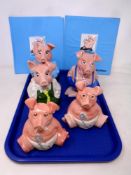 A tray of five Wade Natwest pigs together with two piggy bank statement holders