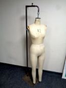 A vintage industrial mannequin by Kennett & Lindesell Limited on adjustable metal stand