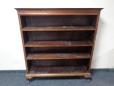 Antique mahogany and pine open shelves on claw and ball feet