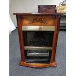 A Dimplex electric coal effect fire in surround