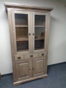 A contemporary double door display cabinet fitted drawer and double door cupboards beneath