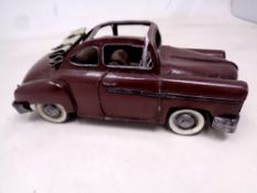 A painted tin plated model car, length 22 cm.