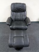 A black leather manual reclining swivel armchair with matching footstool
