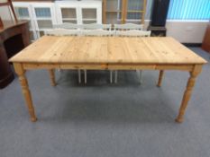 A pine square flap sided dining table and two extension leaves