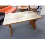 A blond oak extending refectory dining table
