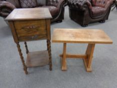 An early 20th century oak sewing table on barley twist legs together with a further oak refectory