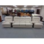 A mid 20th century Parker Knoll three piece lounge suite in oatmeal coloured fabric