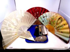 A tray of a collection of antique and later hand fans together with an antique beaded purse