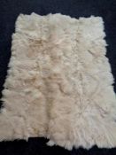 A pair of goat skin rugs