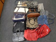 A box of lady's leather and fabric hand bags