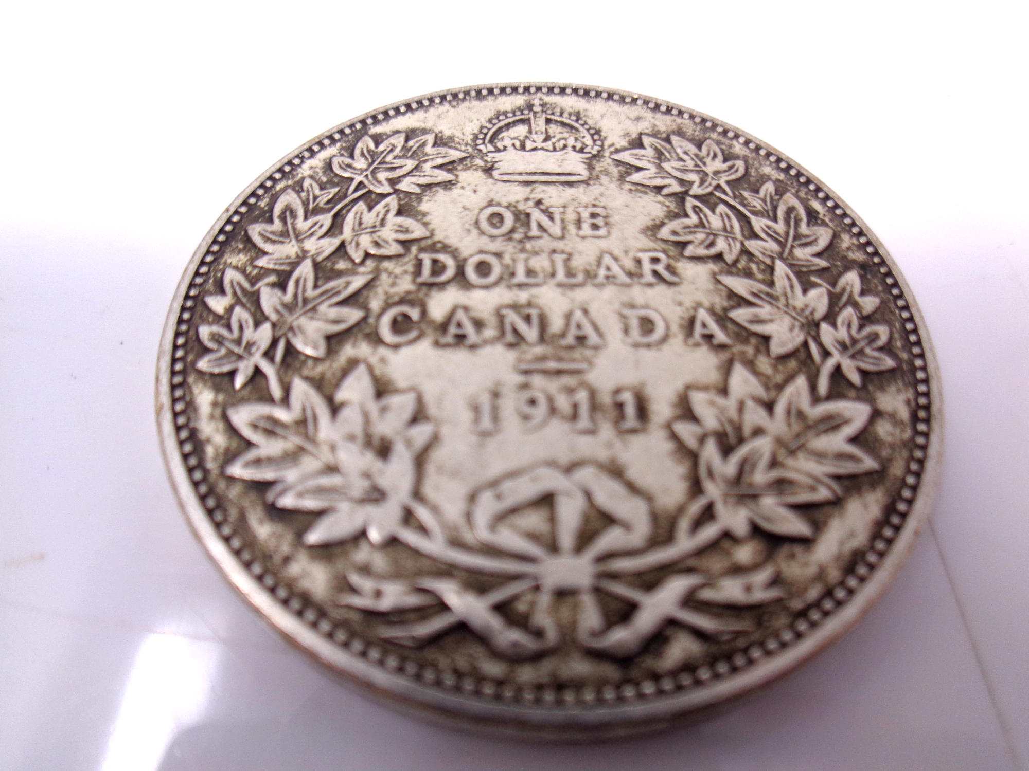 A Canadian 1911 one dollar coin.