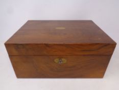 A Victorian walnut travelling writing box with key