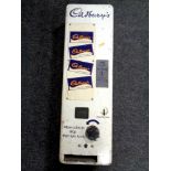 A mid 20th century enamelled wall mounted Cadbury's Chocolate vending machine