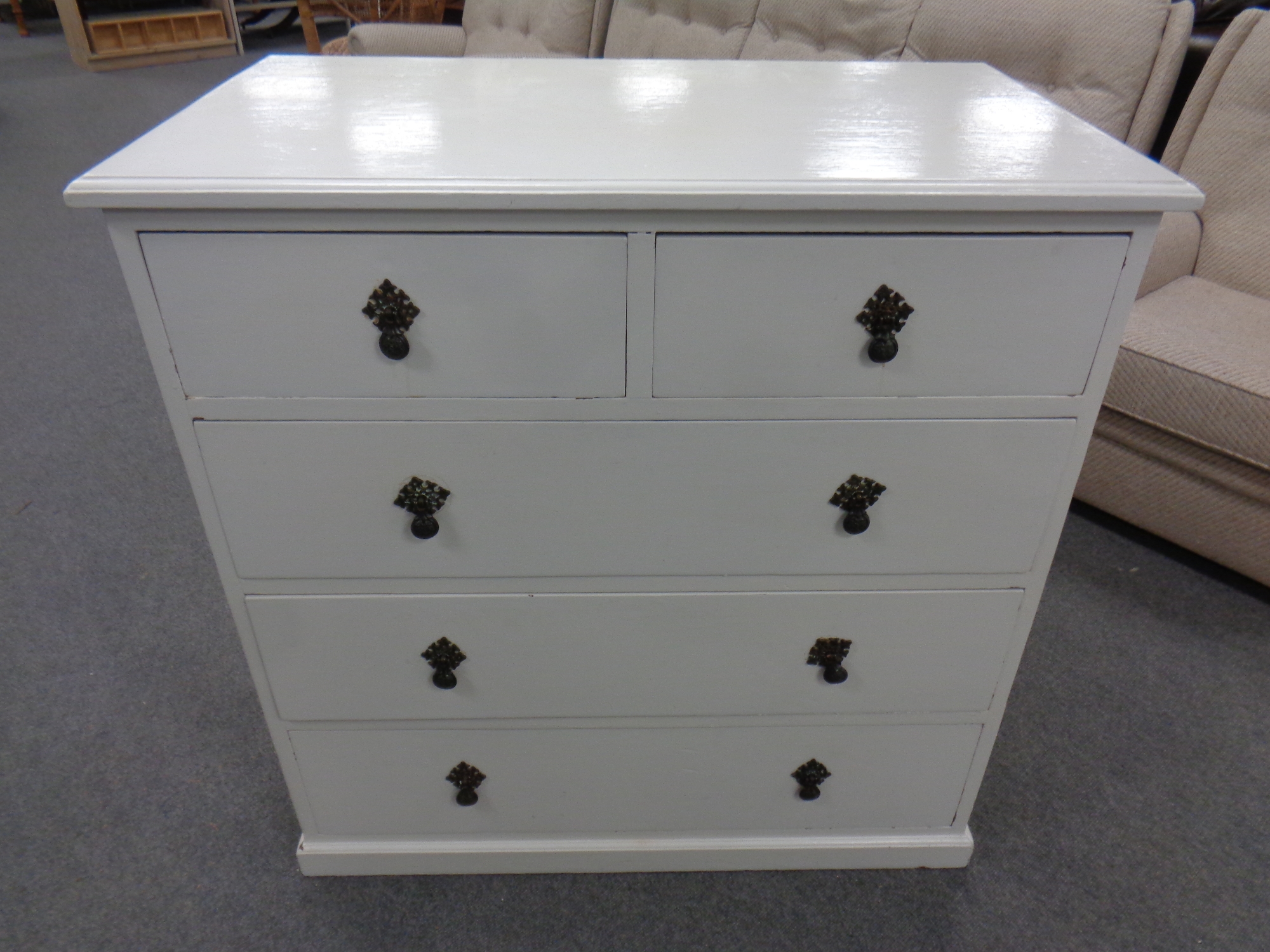 An Edwardian oak painted five drawer chest