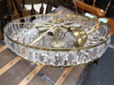 A brass and glass pendant light fitting