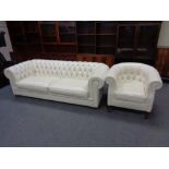A Natuzzi cream leather Chesterfield club settee and similar tub chair