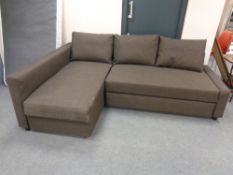 A contemporary corner bed settee in brown fabric