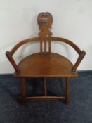 An early 20th century continental rustic oak armchair
