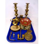 A tray of antique and later brass ware - 19th century candlesticks, miniature jugs, anchor,