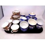 A tray of part antique Osbourne china Fanfare tea service together with nineteen pieces of