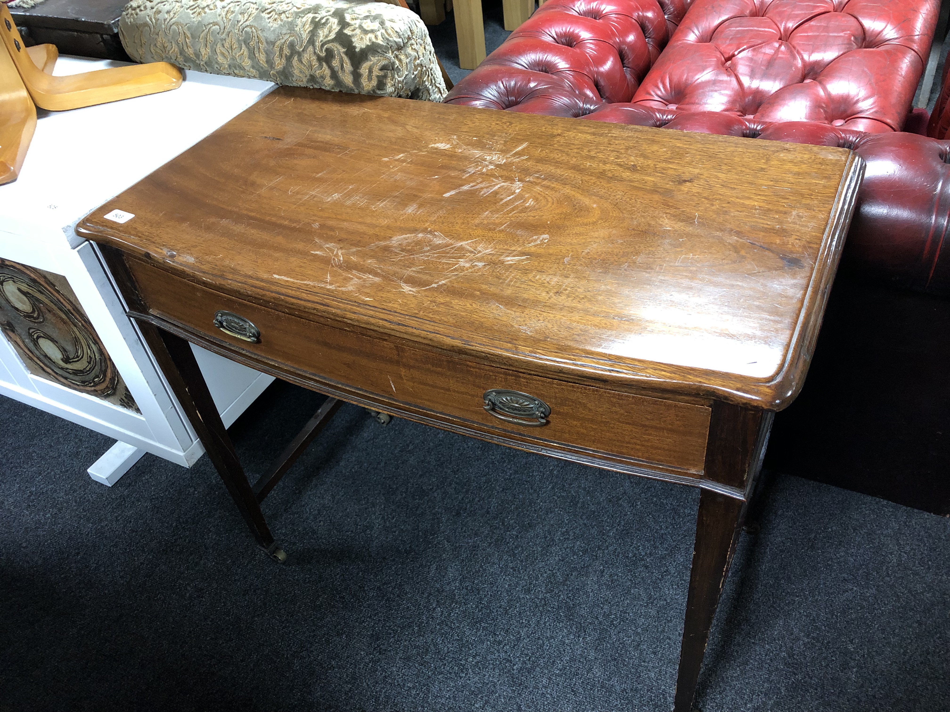 A 19th century mahogany serving table fitted a drawer