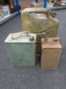 A 20 litre jerry and two vintage Esso oil cans