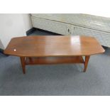 A shaped mid 20th century teak coffee table