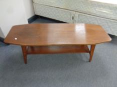 A shaped mid 20th century teak coffee table